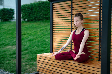 Girl practice yoga and meditation in the cityの写真素材