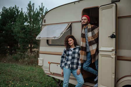 Romantic couple spending time together near trailer homeの写真素材