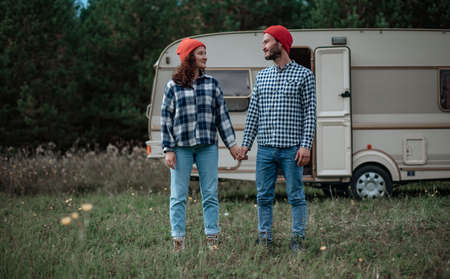 Couple spending time together near trailer home. Traveling with motor home.の写真素材