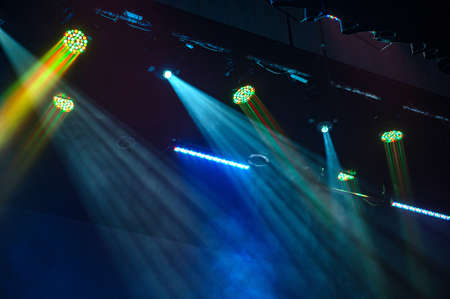 Multi color light on dark stage. Spotlightsの写真素材