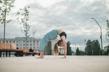 Girl practice yoga and meditation in the city.の写真素材