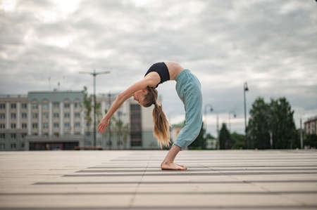 Girl practice yoga and meditation in the city.の写真素材