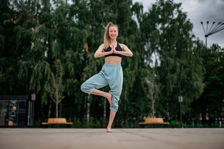 Girl practice yoga and meditation in the city.の写真素材