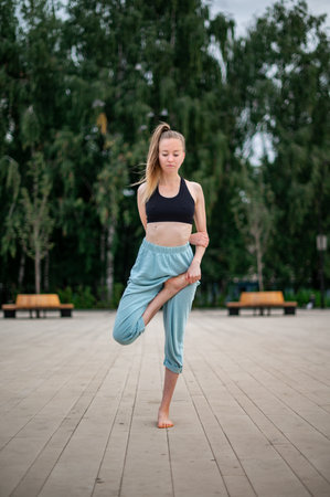 Girl practice yoga and meditation in the city.の写真素材