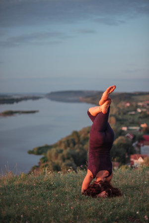 Yoga practice and meditation outdoor. Girl in the parkの写真素材