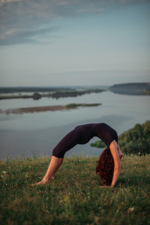 Yoga practice and meditation outdoor. Girl in the parkの写真素材