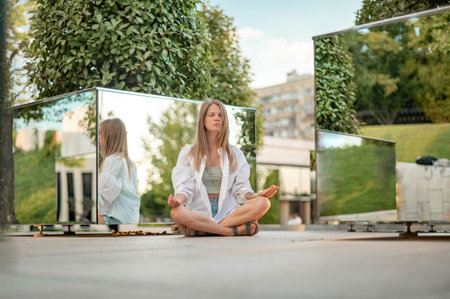 Girl practice yoga meditation outdoor in parkの写真素材
