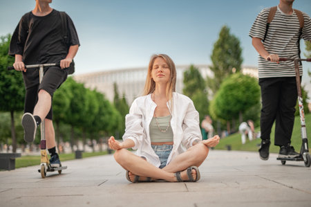 Girl practice yoga meditation outdoor in park