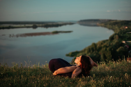 Yoga practice and meditation outdoor. Girl in the parkの写真素材
