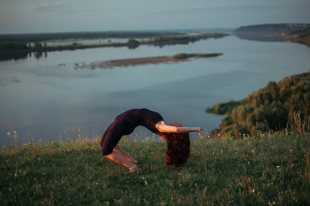 Yoga practice and meditation outdoor. Girl in the parkの写真素材