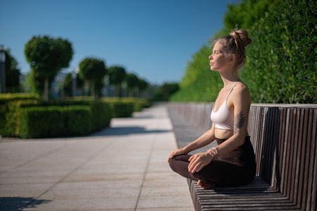 Girl practice yoga meditation outdoor in parkの写真素材
