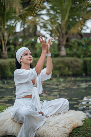 Girl practice yoga meditation outdoor in parkの写真素材