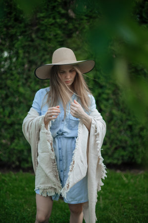 Romantic girl with hat on picnic in parkの写真素材
