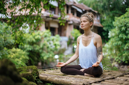 Girl practice yoga meditation outdoor in parkの写真素材