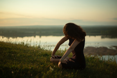 Yoga practice and meditation outdoor. Girl in the parkの写真素材