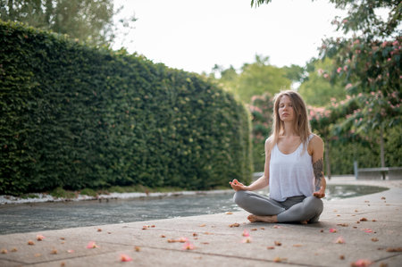 Girl practice yoga meditation outdoor in parkの写真素材