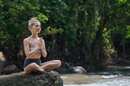 Girl practice yoga meditation outdoor in parkの写真素材
