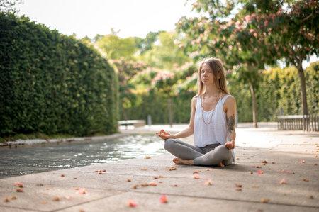 Young girl practice meditation in the parkの写真素材