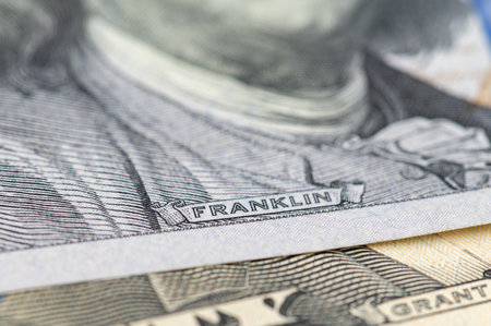 Close up 100 Dollar bank note. Franklin face macro. One hundred American dollars.の写真素材