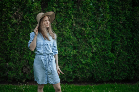 Romantic girl with hat on picnic in parkの写真素材