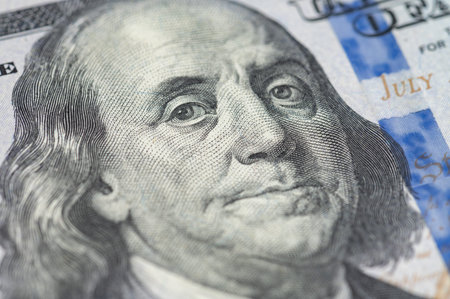 Close up 100 Dollar bank note. Franklin face macro. One hundred American dollars.