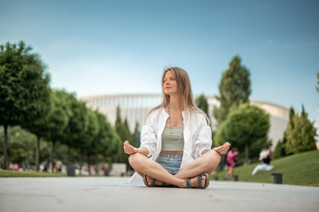 Girl practice yoga meditation outdoor in parkの写真素材