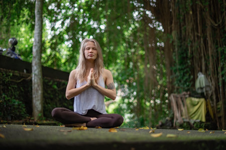 Girl practice yoga meditation outdoor in parkの写真素材