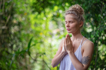Girl practice yoga meditation outdoor in parkの写真素材