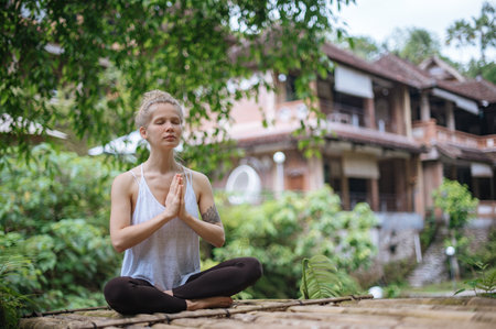 Girl practice yoga meditation outdoor in parkの写真素材