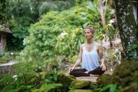 Girl practice yoga meditation outdoor in parkの写真素材