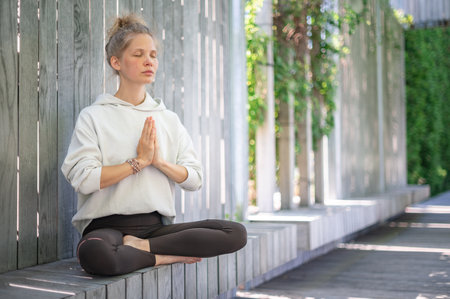 Girl practice yoga meditation outdoor in parkの写真素材