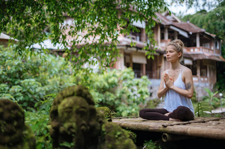 Girl practice yoga meditation outdoor in parkの写真素材