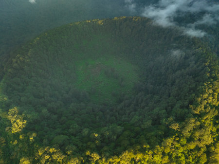 A breathtaking aerial view of a lush forested crater landscape, inviting explorationの写真素材