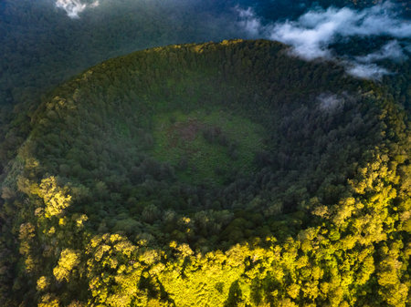 A breathtaking aerial view of a lush forested crater landscape, inviting explorationの写真素材