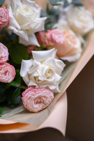 A Stunning Arrangement Featuring a Beautiful Bouquet of Pink and White Roses Alongside Liliesの写真素材