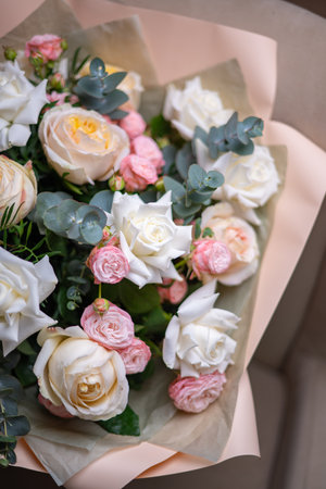 A Stunning Arrangement Featuring a Beautiful Bouquet of Pink and White Rosesの写真素材