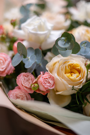 A Stunning Arrangement Featuring a Beautiful Bouquet of Pink and White Roses Alongside Liliesの写真素材