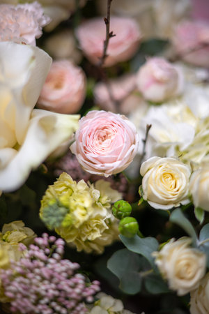 A Stunning Arrangement Featuring a Beautiful Bouquet of Pink and White Roses Alongside Liliesの写真素材