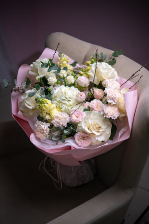 A Stunning Arrangement Featuring a Beautiful Bouquet of Pink and White Roses Alongside Liliesの写真素材