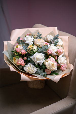A Stunning Arrangement Featuring a Beautiful Bouquet of Pink and White Rosesの写真素材