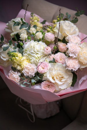 A Stunning Arrangement Featuring a Beautiful Bouquet of Pink and White Rosesの写真素材