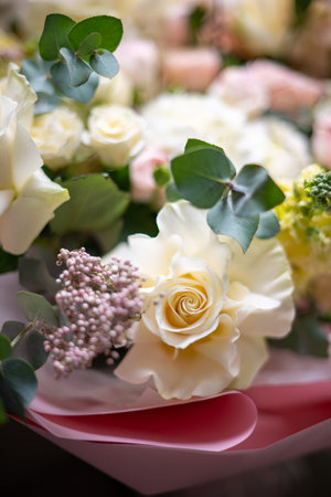 A Stunning Arrangement Featuring a Beautiful Bouquet of Pink and White Roses Alongside Liliesの写真素材