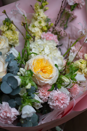 A Stunning Arrangement Featuring a Beautiful Bouquet of Pink and White Rosesの写真素材