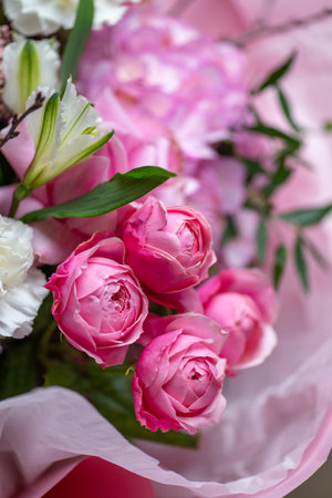 A Stunning Arrangement Featuring a Beautiful Bouquet of Pink and White Roses Alongside Liliesの写真素材