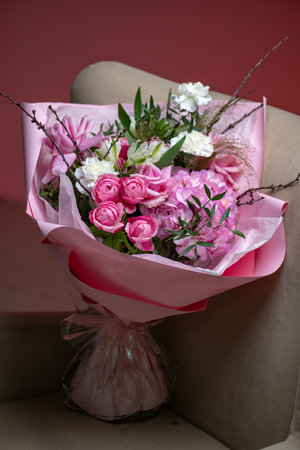 A Stunning Arrangement Featuring a Beautiful Bouquet of Pink and White Roses Alongside Liliesの写真素材