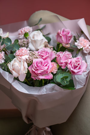 A Stunning Arrangement Featuring a Beautiful Bouquet of Pink and White Roses Alongside Liliesの写真素材