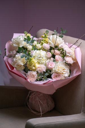 A Stunning Arrangement Featuring a Beautiful Bouquet of Pink and White Roses Alongside Liliesの写真素材