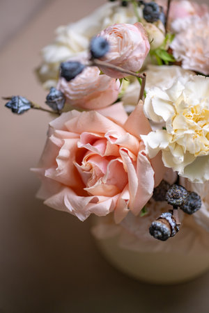 Delicate composition of white and pink roses in a basketの写真素材
