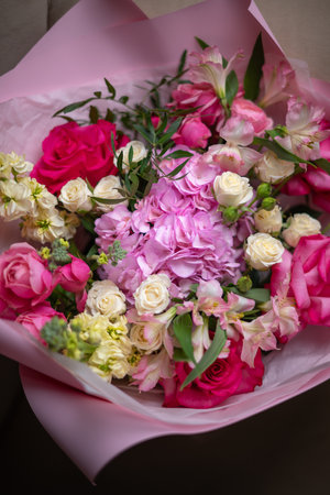 Delicate composition of white and pink rosesの写真素材