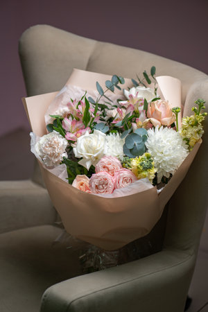 Delicate composition of white and pink roses in a basketの写真素材